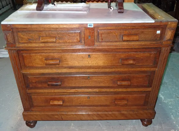 An early 20th century Continental oak chest of two short and three long drawers, with white marble top on bun feet, 102cm wide x 92cm high (a.f).   H9