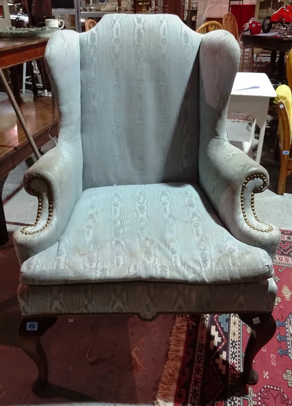 A Queen Anne style mahogany framed wingback armchair, on cabriole supports.  J3