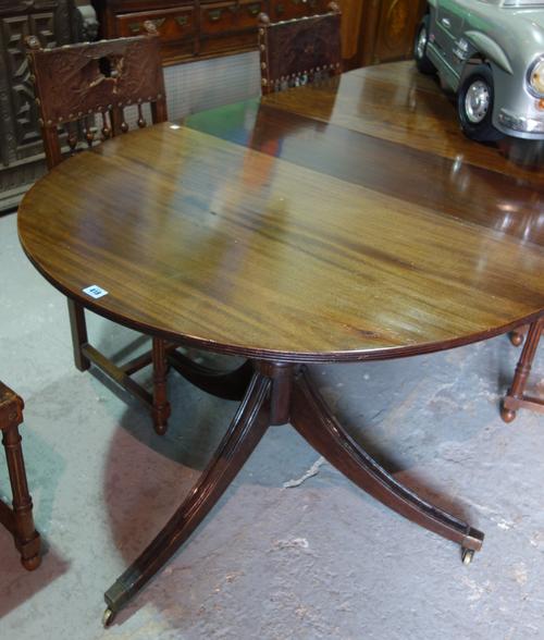 A Regency style mahogany 'D' end dining table, with two extra leaves, on reeded outswept supports, 136cm wide x 72cm high, 206cm fully extended.  C9