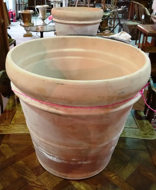 A pair of large 20th century terracotta ribbed plant pots, 57cm wide x 55cm high.  B5