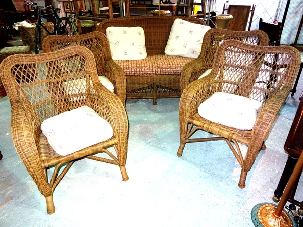 A 20th century rattan conservatory suite, comprising; a sofa (140cm wide), and four matching armchairs, (5).  F8