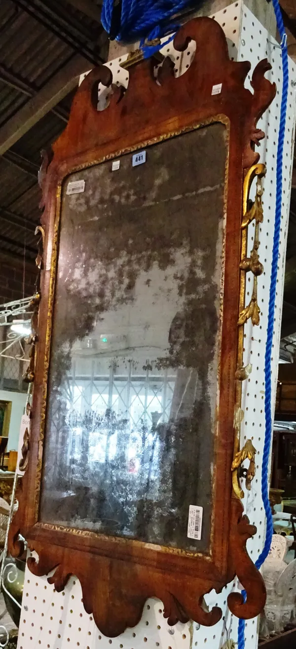 A George II walnut and parcel gilt fret mirror, 55cm wide x 106cm high, (a.f).   D5
