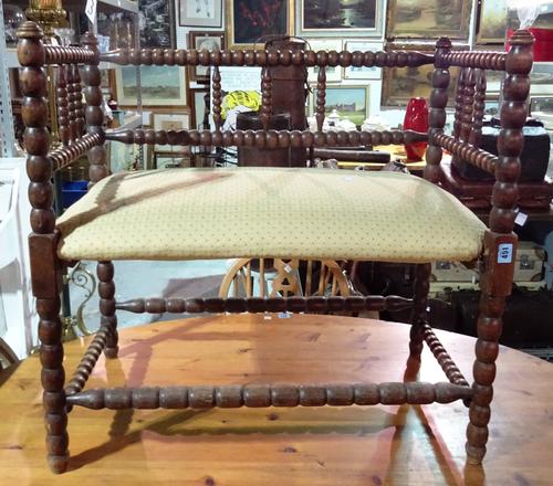 An 18th century style oak framed bobbin turned hall bench, 78cm wide x 74cm high.  H3