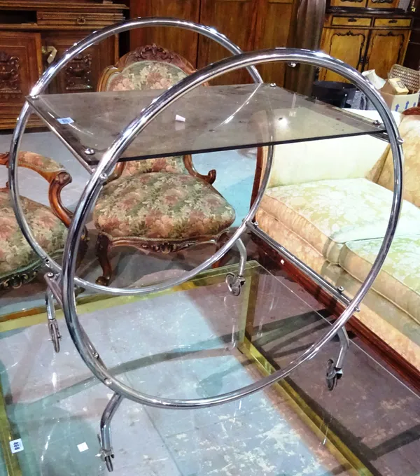 A 20th century chrome and glass two tier serving trolley, 58cm wide x 78cm high.  J7