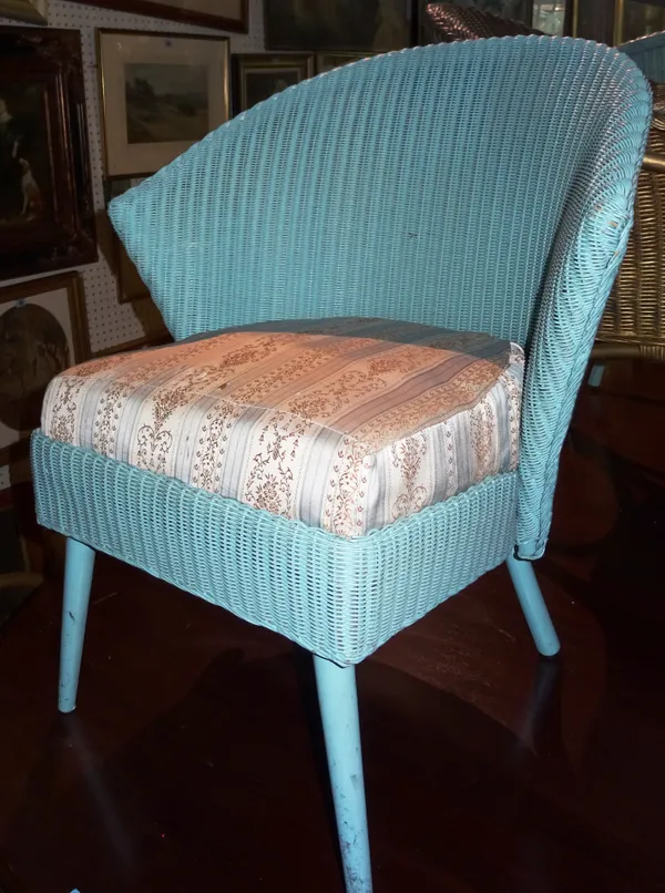 A blue Lloyd Loom armchair and two further similar, (3).  K2