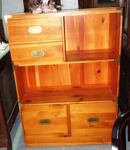 A 20th century campaign style pine bookcase, over a cupboard base, 90cm wide x 127cm high.  H9