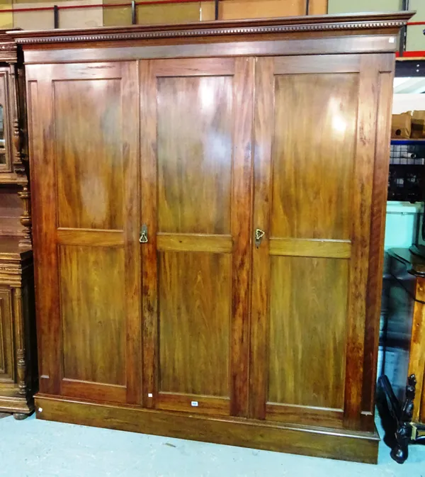 A late Victorian mahogany triple wardrobe, 190cm wide x 206cm high.  M7