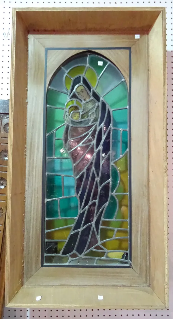 Two similar early 20th century stained glass panels in wooden frames, each 60cm wide x 116cm high, (2).  I10