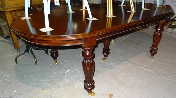 A Victorian mahogany extending 'D' end dining table, on tapering reeded supports, to include two extra leaves, 223cm wide x 80cm high, 275cm fully ext