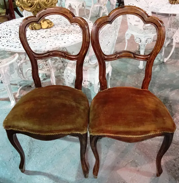 A set of six Victorian walnut balloon back dining chairs, on cabriole supports, (6).  F9