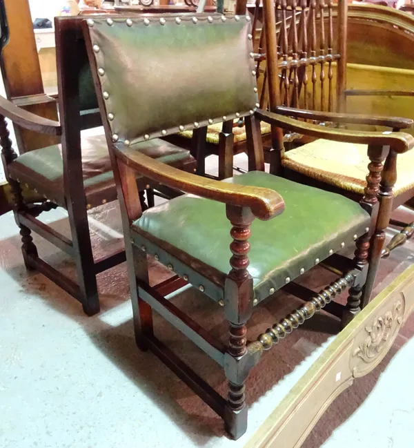 A pair of Victorian oak open armchairs, with green leather upholstery, (2).  J6