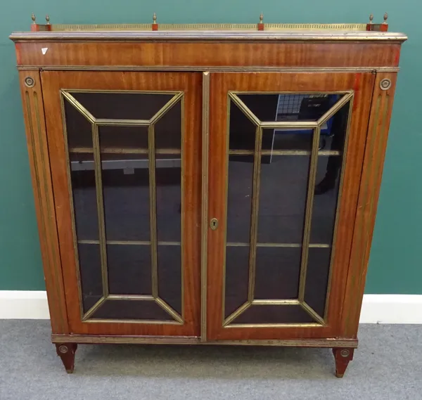 A late 19th century North European brass mounted mahogany two door display cabinet, on tapering square supports, 120cm wide x 129cm high x 34cm deep.