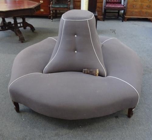 A large freestanding stool of shaped oval form, with raised lozenge shaped centre, 217cm long x 180cm deep.  M8