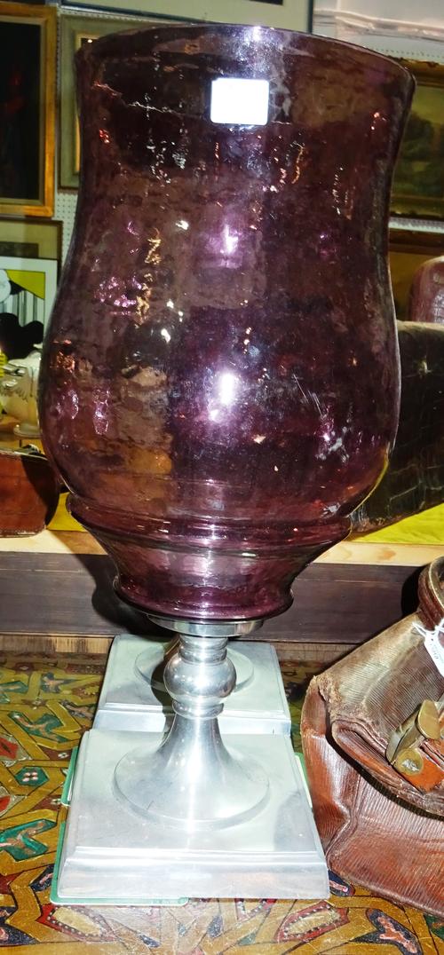 A pair of 20th century silvered metal hurricane lamps with amethyst glass shades, one broken, (a.f)  I4