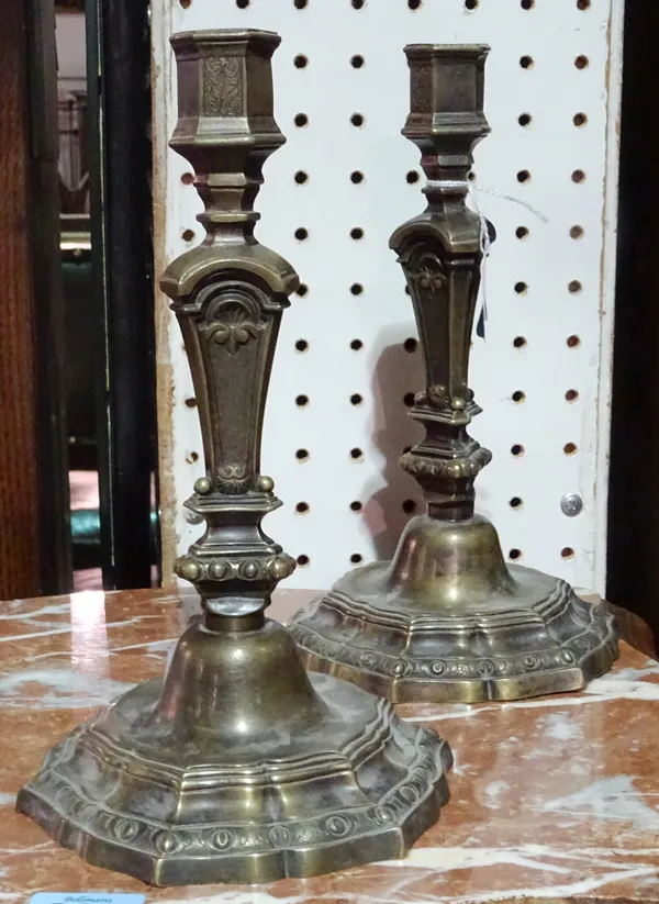 A pair of 18th century style French candlesticks, 20th century, with hexagonal sconces over a triform tapering stem and hexagonal foliate cast base, 2