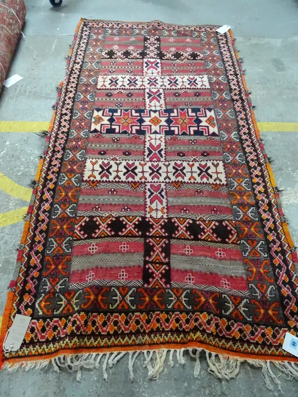 A Turkish half piled rug with banded decoration, a waved border, 215cm x 110cm.  C4