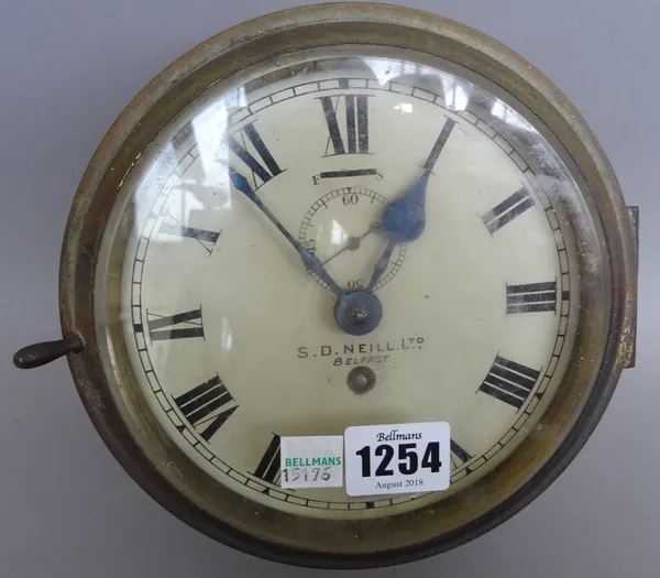 An Irish gilt metal cased 'port hole' wall clock, with slow/fast adjustment and subsidiary seconds dial, detailed 'S.P Neill Ltd, Belfast', seven inch