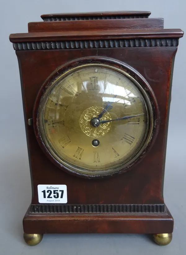 A French mahogany cased mantel clock, late 19th century, with stepped rectangular surmount and brass dial, on four spherical gilt metal feet, with a s