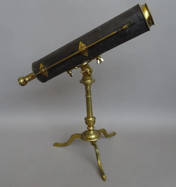 A 2-inch brass reflecting telescope on stand, English late 18th century, the leather bound tube with focusing to the secondary reflector by long shank