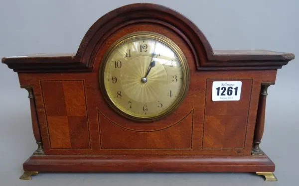 An Edwardian mahogany and inlaid dome top mantel clock with engine turned dial, flanked by pillared supports (31.5cm), a reproduction brass lantern cl