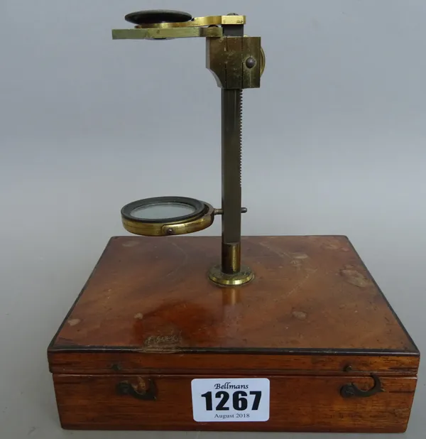 A 19th century mahogany cased travelling microscope, with screw attachment to the hinged lid, fitted blue velvet lined interior and accessories, (case