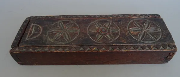 A Napoleonic prisoner-of-war bone carved dominoes set, in a later foliated carved oak box, with sliding lid, 22.5cm wide.