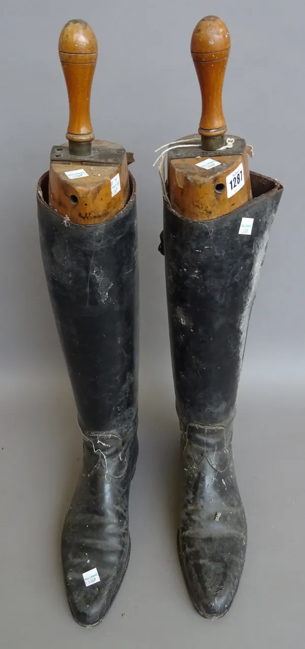 A pair of gentleman's leather riding boots, with fruitwood lasts stamped 'PEAL & Co MAKERS', a red foliate painted metal hat box, a red painted Middle