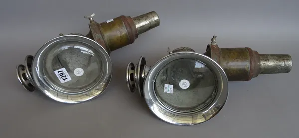 A pair of German automobile lamps, early 20th century, chrome and brass with applied plaque 'HERM RIEMANN CHEMNITZ GABLENZ GERMANY', 36cm high, (2).