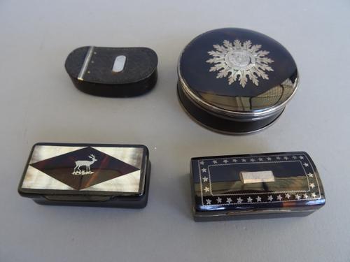 An early Victorian tortoiseshell snuff box of oval outline with basket weave hinged top and applied silver plaque, 5.5cm wide, a Continental silver in