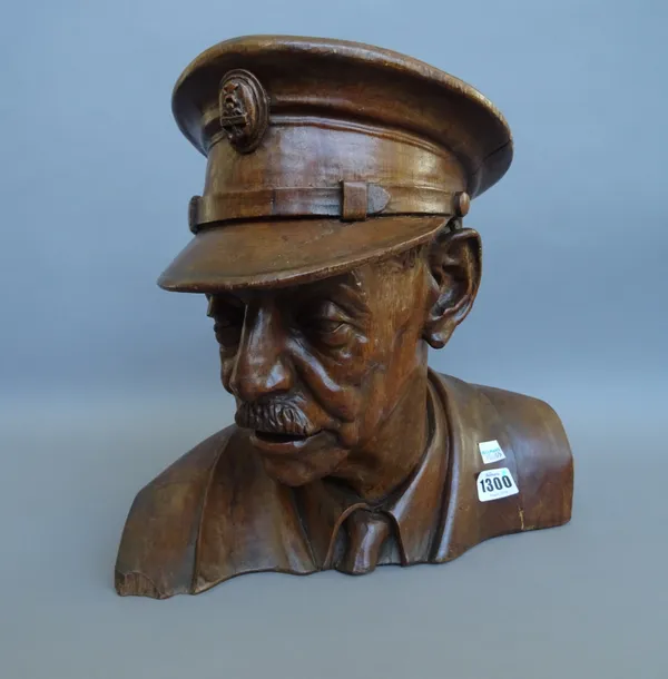A carved walnut bust depicting a naval officer, 20th century, unsigned, 34cm high. Illustrated
