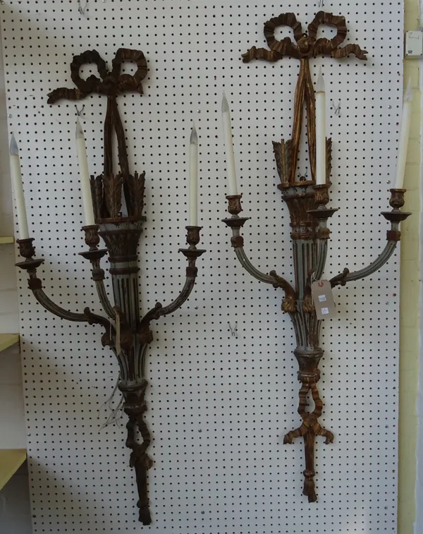 A pair of Georgian style giltwood carved three branch wall appliques, early/ mid-20th century, distressed grey and gilt with ribbon tied surmount and