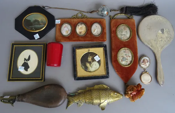 A group of small collectables including; an early 20th century brass reticulated fish (20cm), a leather shot dispenser, a silver hand mirror, a silhou