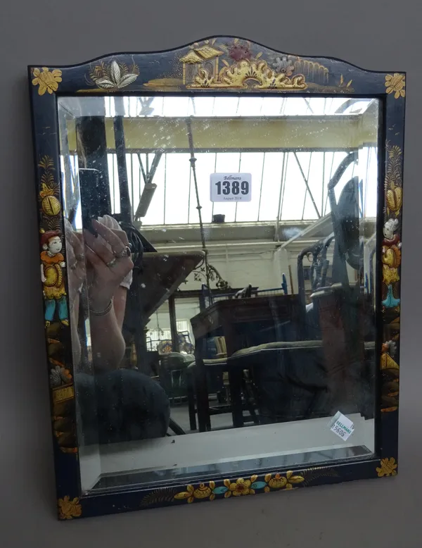 An early 20th century Chinoiserie decorated ebonised mirror with inset bevelled glass panel (36cm high), two smaller similarly decorated strut back ph