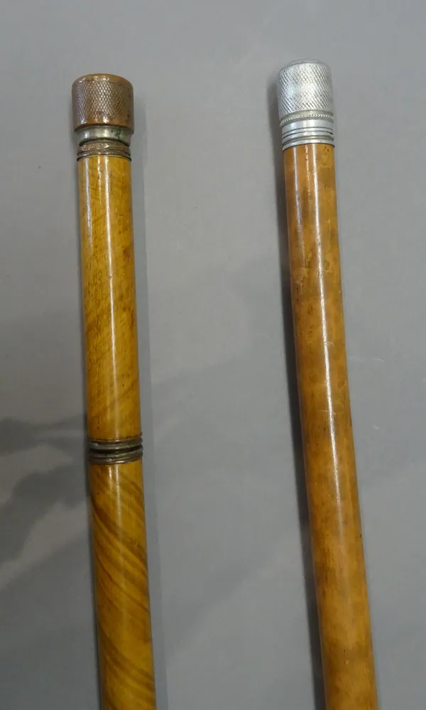 An unusual fruitwood gadget cane, 20th century, each section containing pen, pencil and inkwell (85cm) and a similar, longer 'pen and pencil' gadget c