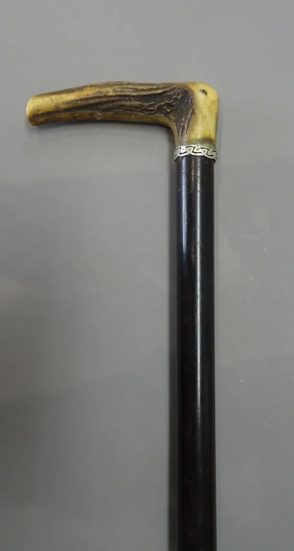 A horn mounted, rosewood 'flute' gadget cane, early 20th century, of sectional form, 88cm.
