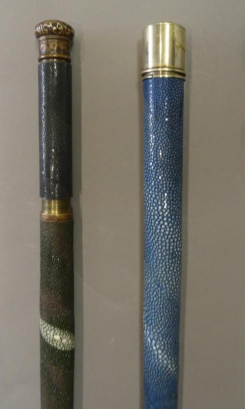 A Victorian and later blue shagreen covered gadget walking cane, with twist top opening to reveal a long glass thermometer (87cm) and another green sh