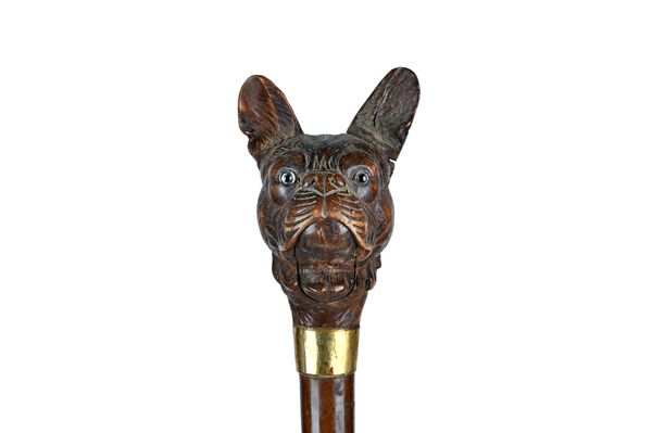 A Black Forest carved wooden 'bulldog' umbrella handle, early 20th century, with automated mouth and ears, with a gilt metal collar, bamboo handle and