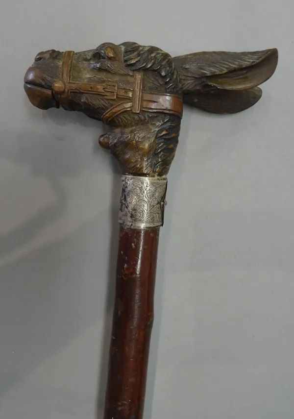 A Black Forest 'donkey' gadget walking cane, late 19th century, the handle carved as a donkey's head, with automated ears and jaw, over a hallmarked s