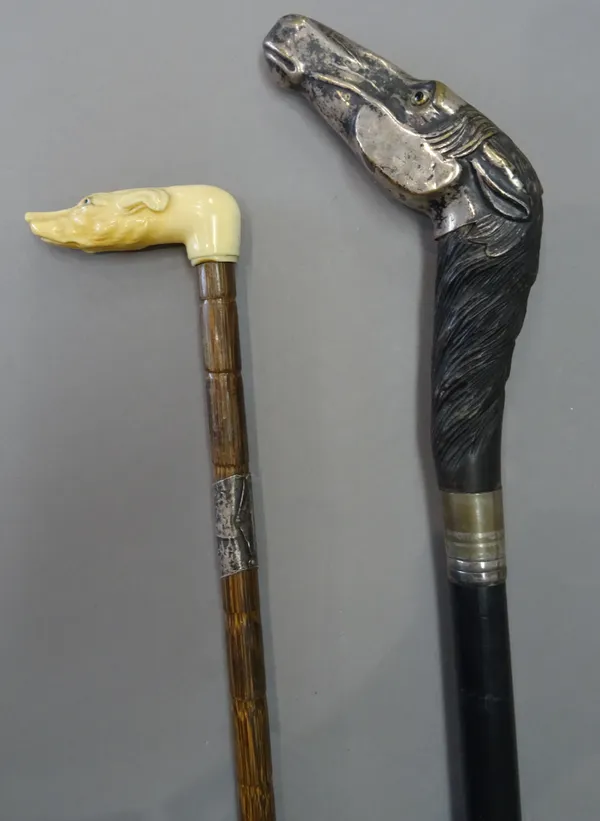 A silver plated 'horse head' walking stick, late 19th century, with carved wooden mane and ebonised shaft (100cm) and a Victorian ivory 'dog's head' w