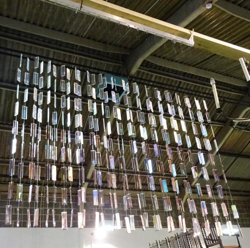 A 20th century glass drop wall hanging, with purple and clear glass drops, 110cm wide x 140cm high.  HANG