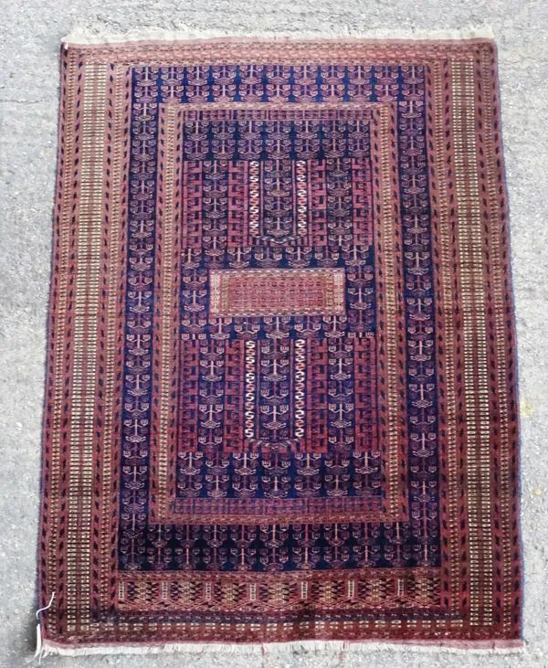 A Turkeman prayer rug, the stylised stepped Mihrab with central panel, within multiple guard stripes, 175cm x 125cm.