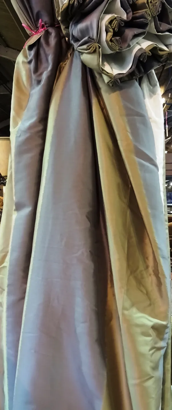A pair of 20th century gold and silver lined and interlined curtains, 120cm wide x 260cm long and a single curtain, (3).  D6