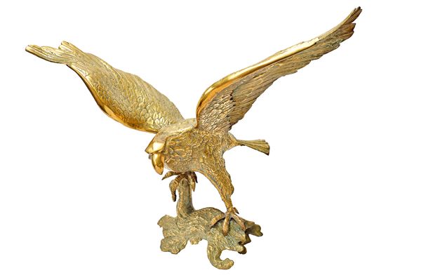 A large cast brass finial moulded as an eagle with outstretched wings, 97cm wide x 72cm high. Illustrated