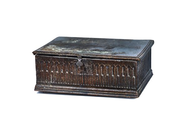 A 17th century oak bible box, the single plank top over an arcade carved frieze, 69cm wide x 24cm high x 51cm deep. Illustrated  Provenance; Property