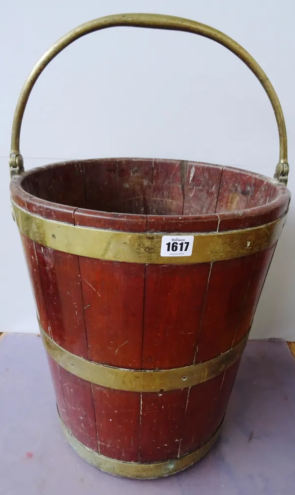 A George III brass bound coopered mahogany peat bucket, with swing-over handle, 36cm diameter x 60cm high including the handle. Provenance; Property f