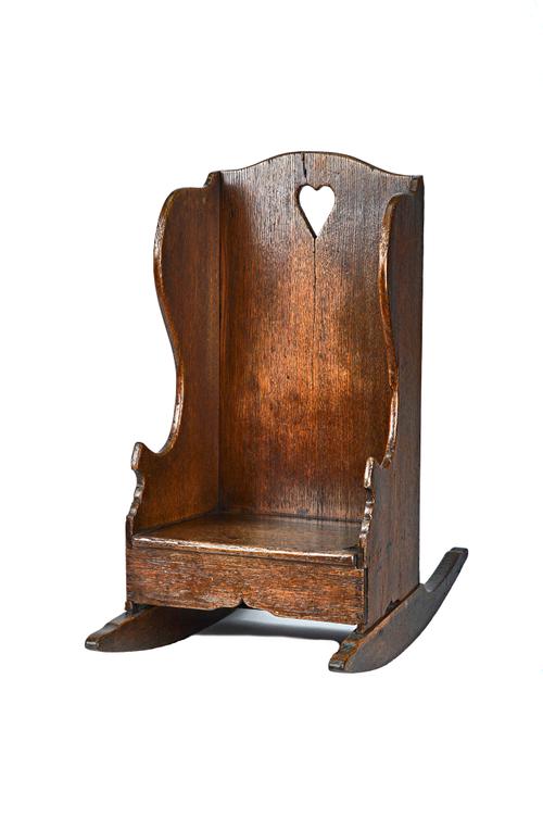 A 19th century oak child's rocking lambing chair, 33cm wide x 64cm high. Illustrated