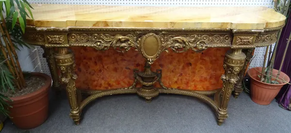 An 18th century Continental style console table, the gilded base with carved and pierced decoration, on tapering fluted supports, united by urn mounte