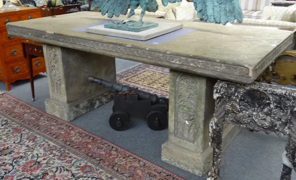 A large 20th century faux stone altar table, on a pair of slab pedestals with Gothic style tracery decoration, 245cm wide x 97cm high x 107cm deep.