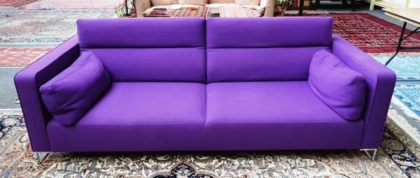 LIGNE ROSET; a 20th century purple upholstered square back sofa, on chrome supports, 234cm wide x 67cm high.