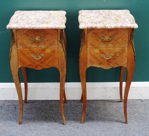 A pair of gilt metal mounted marquetry inlaid kingwood bedside tables each with marble top over bombe two drawer base, 35cm wide x 73cm high x 30cm de